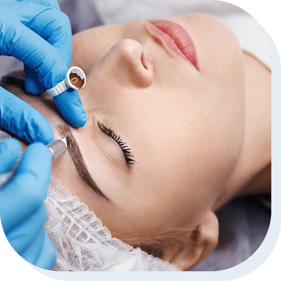 Woman undergoing microblading