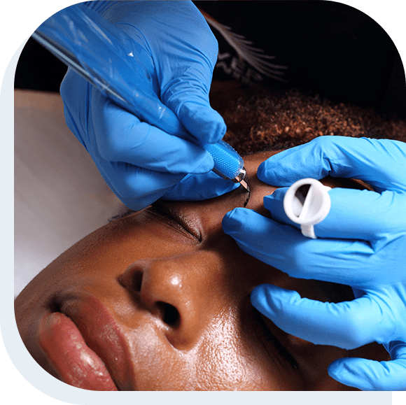 Young african woman getting microblading treatment