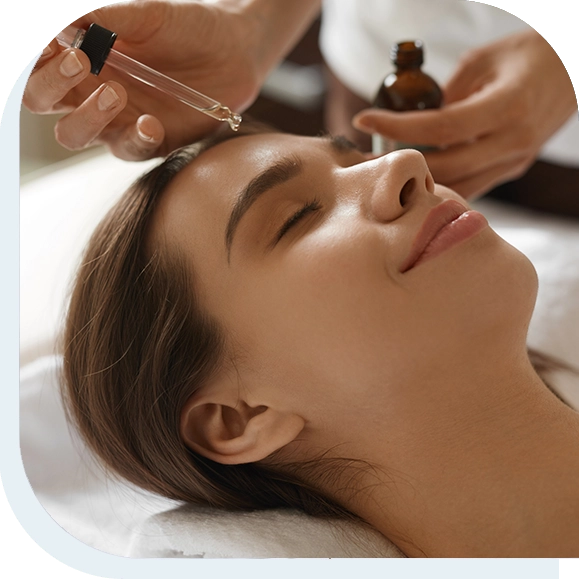 loseup Of Beautiful Smiling Woman Receiving Serum Oil Treatment